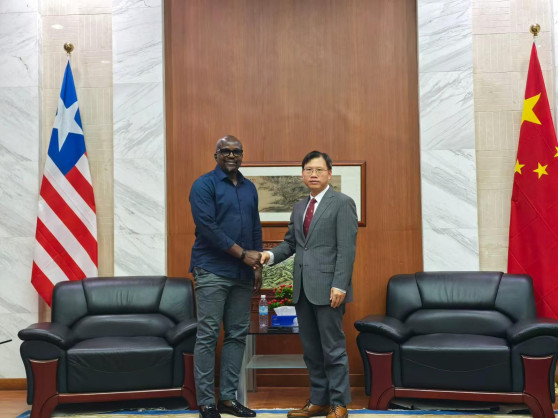 Chinese Ambassador Yin Cheng with Liberian Minister of Public Works Roland Gidding
